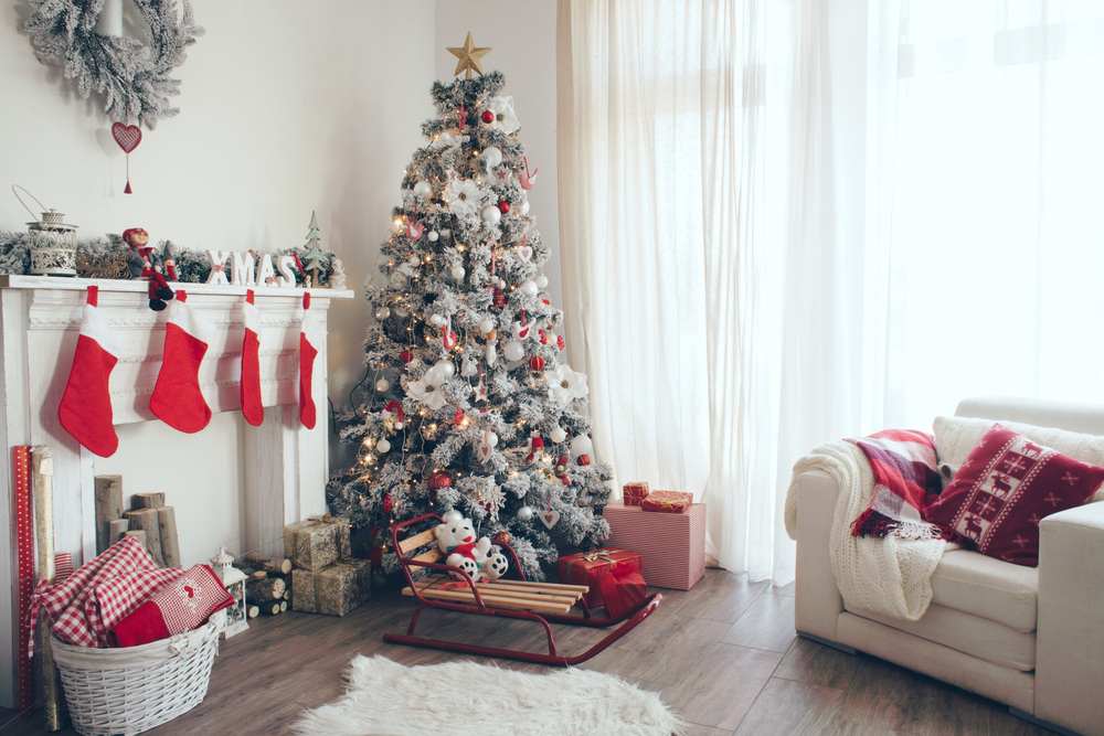 Beautiful Holdiay Decorated Room With Christmas Tree With Presents Under